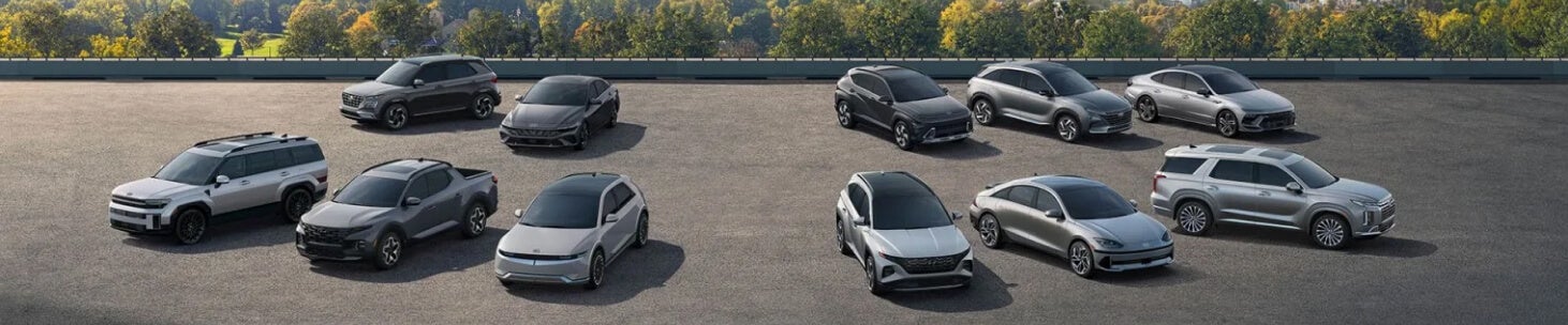 The full 2026 Hyundai lineup parked in a tree-lined parking lot.
